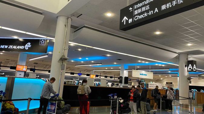 Travellers checking in at Auckland Airport, bound for Australia under the renewed, quarantine-less bubble arrangement. Photo / Juliette Sivertsen
