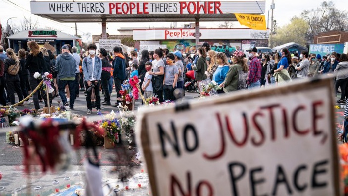 Demonstrators gather for a solidarity rally in memory of the deceased George Floyd and Daunte Wright outside Cup Foods, Sunday, April 18, 2021, in Minneapolis.