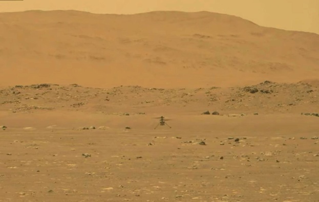 Nasa's experimental Mars helicopter Ingenuity lands on the surface of Mars. Photo / AP