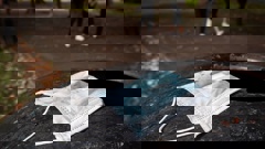 People are being urged not to retreive used face masks from bins but rather use a scarf or t-shirt as a make shift face covering while on public transport. Photo / Jason Oxenham.