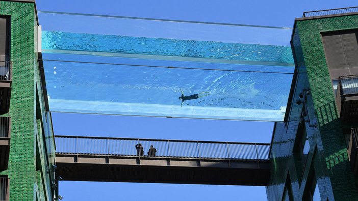 S world first, the transparent 25-metre-long outdoor pool, known as the Sky Pool, will allow residents to swim from one building to the other, 10 stories above the ground.