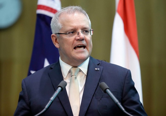 On Friday, Australian Prime Minister Scott Morrison announced that flights from India would be scaled back by 30 per cent, and more restrictions may be coming. Photo / AP