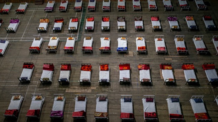 Beds lie inside an indoor stadium converted into COVID-19 treatment center for emergencies in the wake of the spike in the numbers of positive coronavirus cases in Srinagar, Indian controlled Kashmir. (Photo . AP)