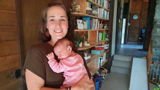Wellington woman Lindy Jacomb, with her newborn daughter Aria, was excommunicated by the Exclusive Brethren 13 years ago, barely out of her teens. (Photo / RNZ)