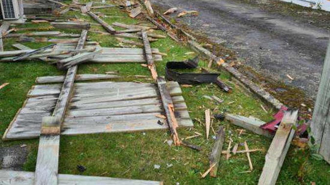 This Trentham fence is now firewood thanks to an early hours crash. (Photo / Supplied)