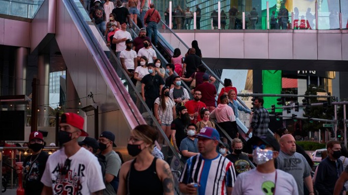 Las Vegas is bustling again after casino capacity limits were raised Saturday, May 1, to 80% and person-to-person distancing dropped to three feet. (Photo / AP)