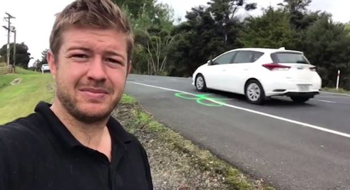 Geoff Upson pictured with one of the many penises he has drawn on Old North Road in the past three years. Photo / File