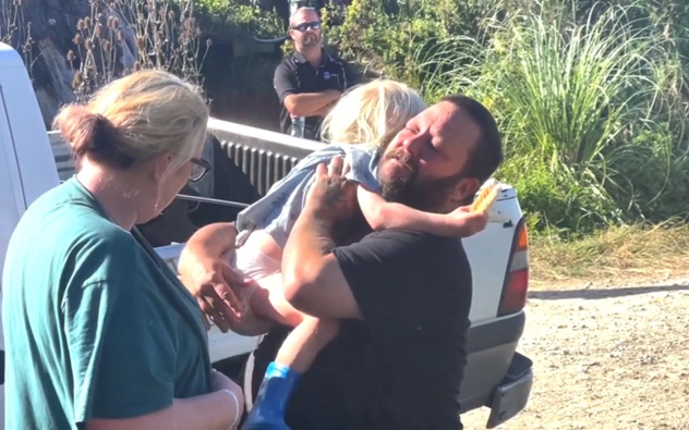 Father Glenn hugs son Axle after the three-year-old was found following an overnight search. Supplied / UAWA Live