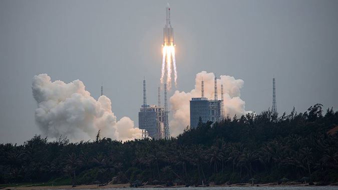 A Long March 5B rocket carrying a module for a Chinese space station lifts off from the Wenchang Spacecraft Launch Site in Wenchang in southern China's Hainan Province. (Chinatopix via AP)