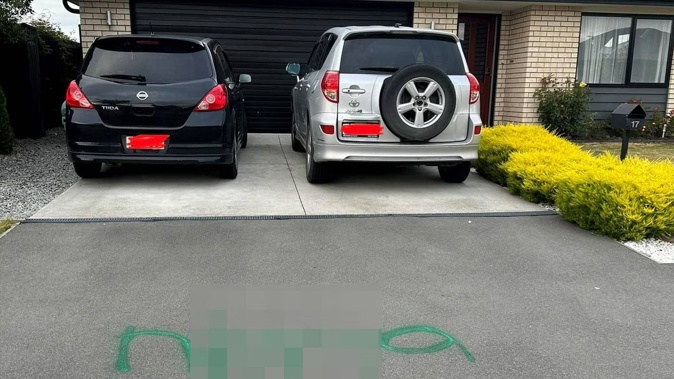 Houses on Chert St, Burnham School Rd were hit by graffiti taggers using green spray paint. Photo / Supplied