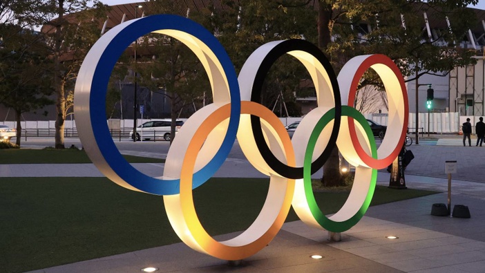 Illuminated Olympic rings are displayed before the new national stadium in Tokyo. (Photo / Photosport)