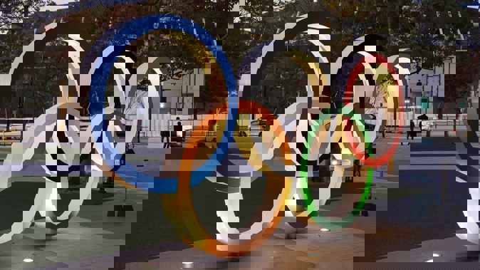 Illuminated Olympic rings are displayed before the new national stadium in Tokyo. (Photo / Photosport)