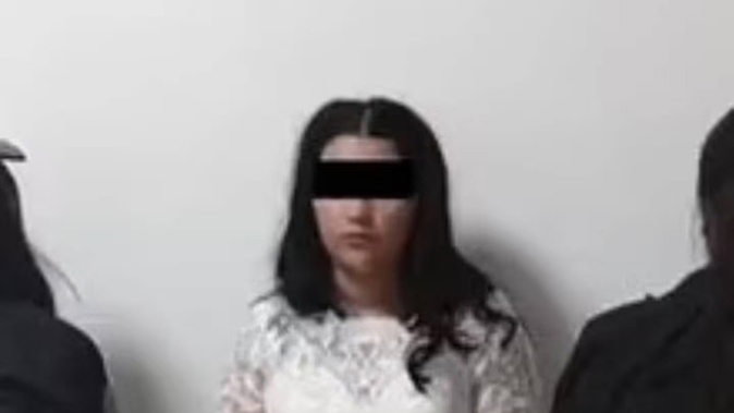 A Mexican bride spent her wedding day in handcuffs last month after she and her soon-to-be husband were charged with a massive extortion scheme involving drug cartels.