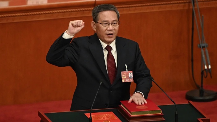 China's newly-appointed Premier Li Qiang takes an oath during the National People's Congress at the Great Hall of the People in Beijing on March 11, 2023. Greg Baker/Pool/AFP/Getty Images