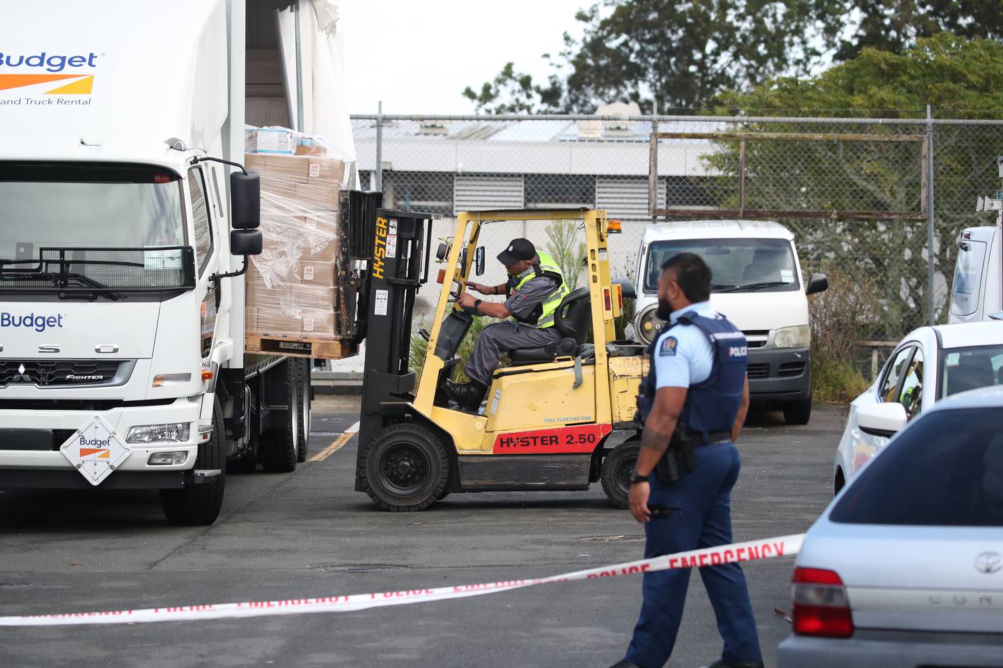 Police loading pallets of beer cans potentially contaminated with methamphetamine from a warehouse on Ryan Pl, Manukau, Auckland. Photo / Jason Oxenham