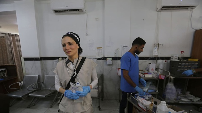 Australian doctor Nada Abu Al-Rub, volunteering at al-Shifa Hospital in Gaza City, Gaza, treats wounded, sick Palestinians. Photo / Getty Images