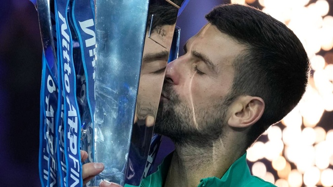 Serbia's Novak Djokovic kisses the trophy after winning the ATP World Tour Finals. Photo / AP