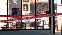 Police tape surrounds one of the restaurants on Corinthian Drive, in Albany, where a number of people were attacked, allegedly by a man wielding a log splitting axe. Photo / Hayden Woodward