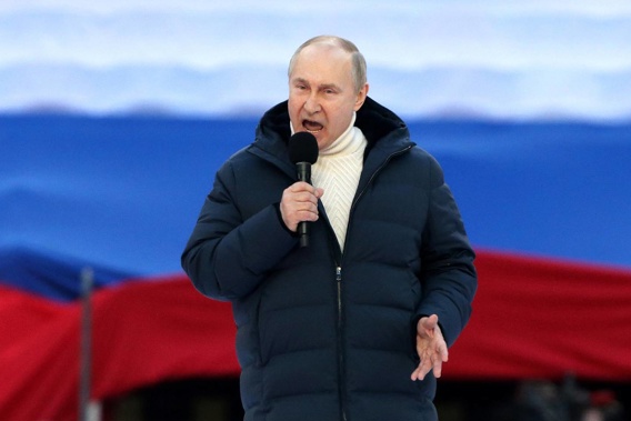 Vladimir Putin speaks during a concert marking the anniversary of the annexation of Crimea. Photo / Getty Images