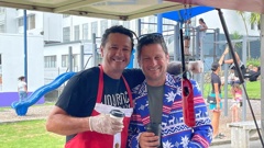 It was a great turnout on Christmas morning with a community breakfast attracting between 100 and 200 people. Here Mike Paora and Gary Younger deliver Christmas cheer.