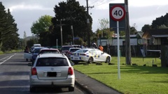 Police outside an Otiria Rd property in Moerewa after an elderly woman died in a dog attack on Thursday. Photo / RNZ