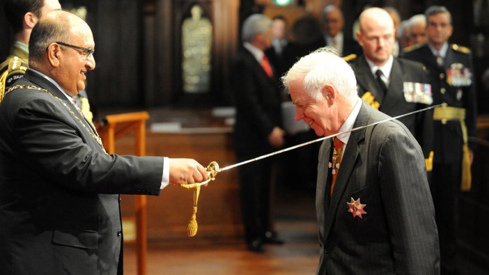 Then Governor-General Sir Anand Satayanand knights Sir Eion Edgar in Wellington on August 14, 2009. Photo / NZPA