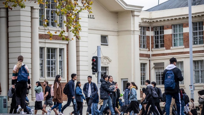 Auckland University students move between lectures on Symonds St. Photo / Michael Craig