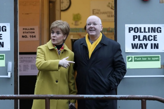 Scottish First Minister Nicola Sturgeon poses for the media with husband Peter Murrell. Photo / AP