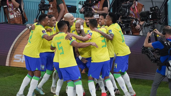 Brazil's Neymar, centre, celebrates his penalty kick goal with teammates during the World Cup round of 16 match between Brazil and South Korea. Photo / AP