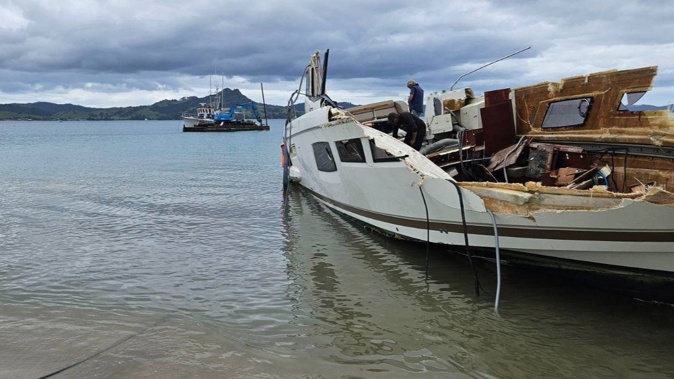 The vessel during the dismantling process at Cooks Beach. Photo / Supplied