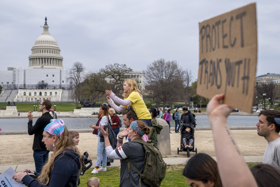 People attend a rally as part of a Transgender Day of Visibility, Friday, March 31, 2023, by the Capitol in Washington. Schools and colleges across the U.S. would be forbidden from enacting outright bans on transgender athletes under a proposal released Thursday, April 6, from the Biden administration, but teams could create some limits in certain cases, for example, to ensure fairness. Photo / AP