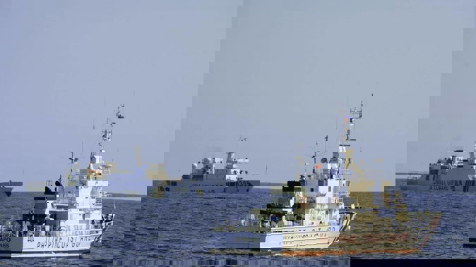 A Chinese Coast Guard ship sails near a Philippine Coast Guard vessel during its patrol at Bajo de Masinloc, 124 nautical miles west of Zambales province, northwestern Philippines. Photo / AP