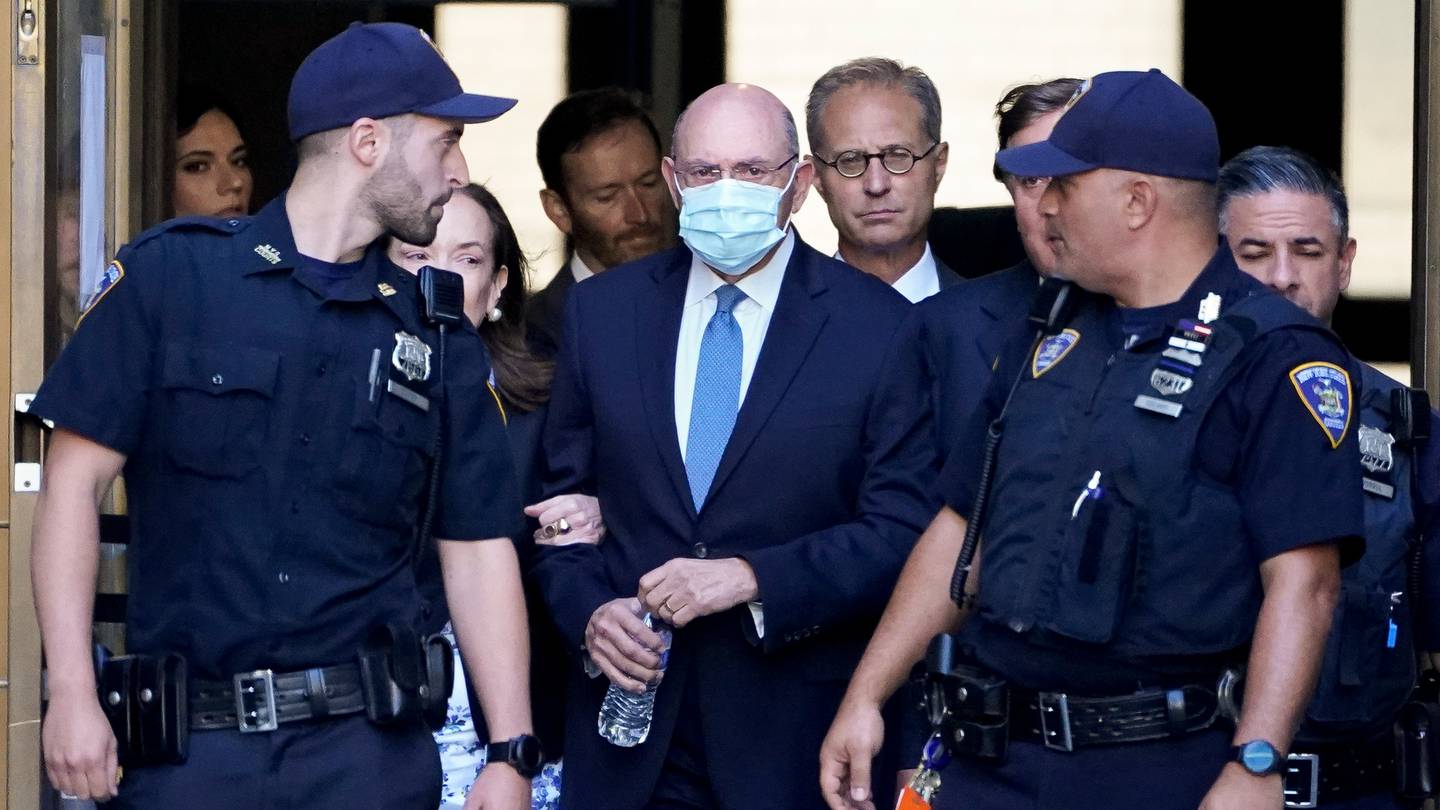 Trump Organisation's former Chief Financial Officer Allen Weisselberg, centre, leaves court in New York. Photo / John Minchillo, AP
