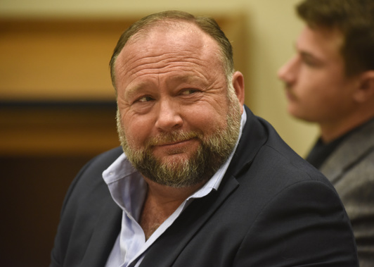 Infowars founder Alex Jones appears in court to testify during the Sandy Hook defamation damages trial. Photo / AP