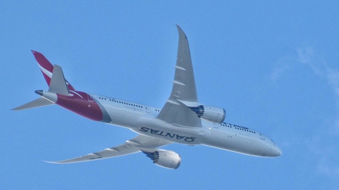 A Qantas Dreamliner approaching Auckland. Photo / Darren Masters