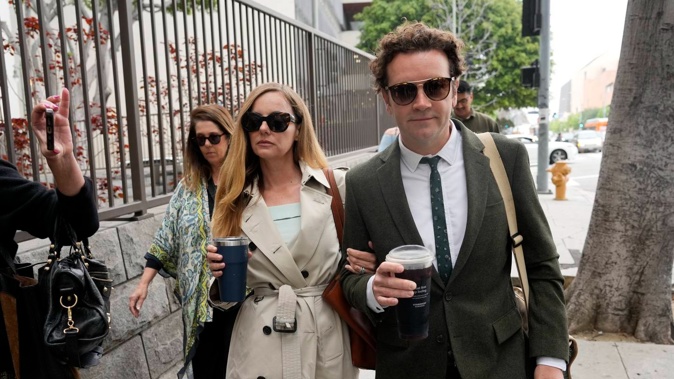 Danny Masterson and his wife Bijou Phillips arrive for closing arguments last month. Photo / AP
