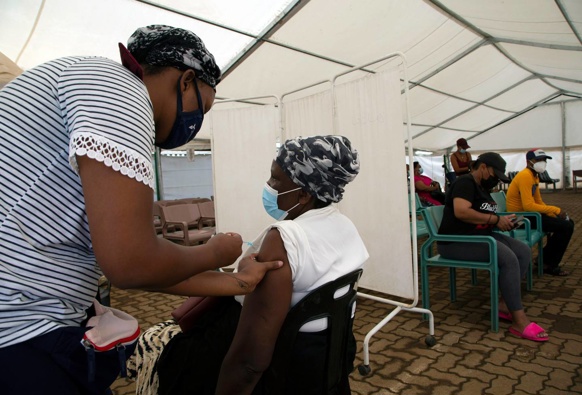 A woman receives a dose of a Covid-19 vaccine at a centre in Soweto, South Africa on November 29. (Photo / AP)