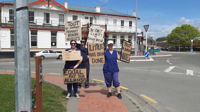 CHB primary health nurses Mary Beale, Leisa Sowelu and Bec Mazzeo were roadside in Waipukurau protesting the lack of pay parity for primary health care and Plunket nurses. Photo / Rachel Wise