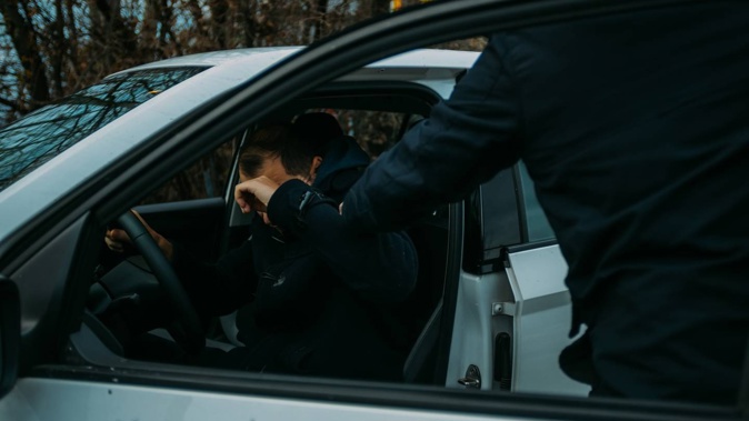 A teen was stabbed after he was beaten and pulled from his car at a party. Photo / 123rf