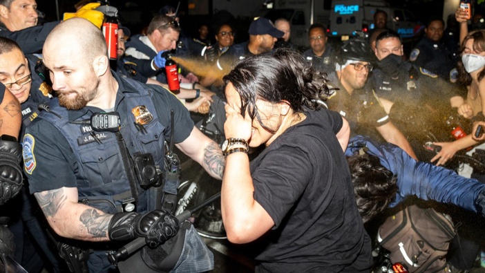 Officers of the Metropolitan Police Department pepper spray demonstrators at George Washington University in Washington, early Wednesday, May 8, 2024. Photo / AP