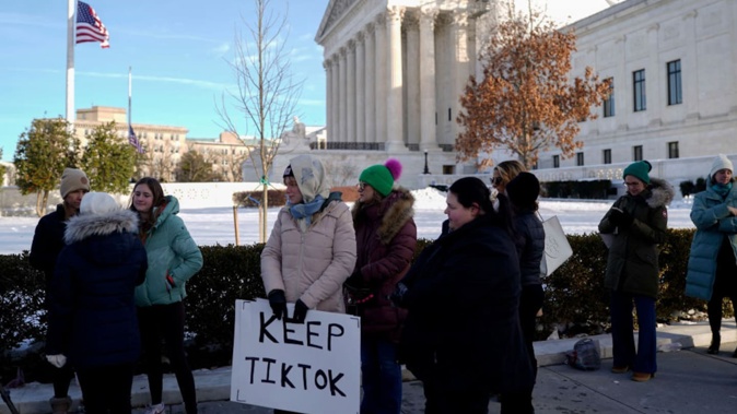 A demonstrator holds a "Keep TikTok" sign outside the US Supreme Court in Washington, DC during January 10 hearings. The hearings pitted national security against free speech. Photo / Getty Images