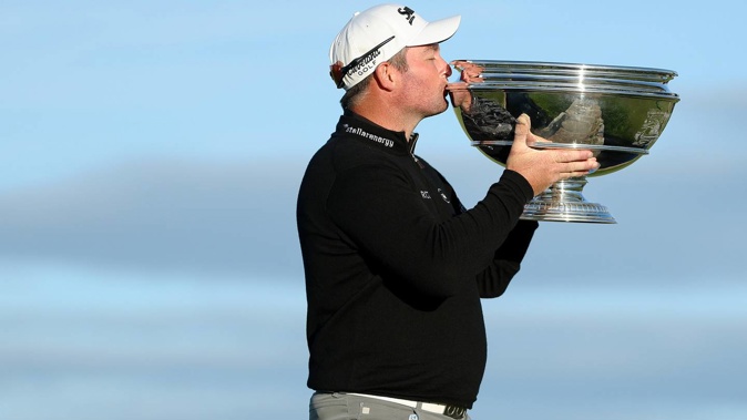 New Zealand's Ryan Fox kisses the trophy after winning the Alfred Dunhill Links Championship on the Old Course St Andrews. Photo / Getty Images