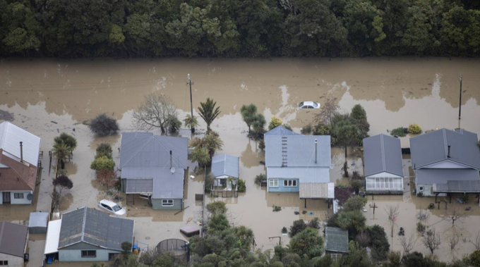 Most houses in the central area of Westport under water up to window-level. (Photo / Herald)