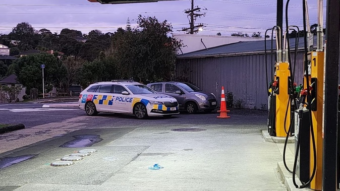 Police at the scene of Kaurilands Superette after three youths attempted to rob the store on February 27. Photo / Dylan Samson