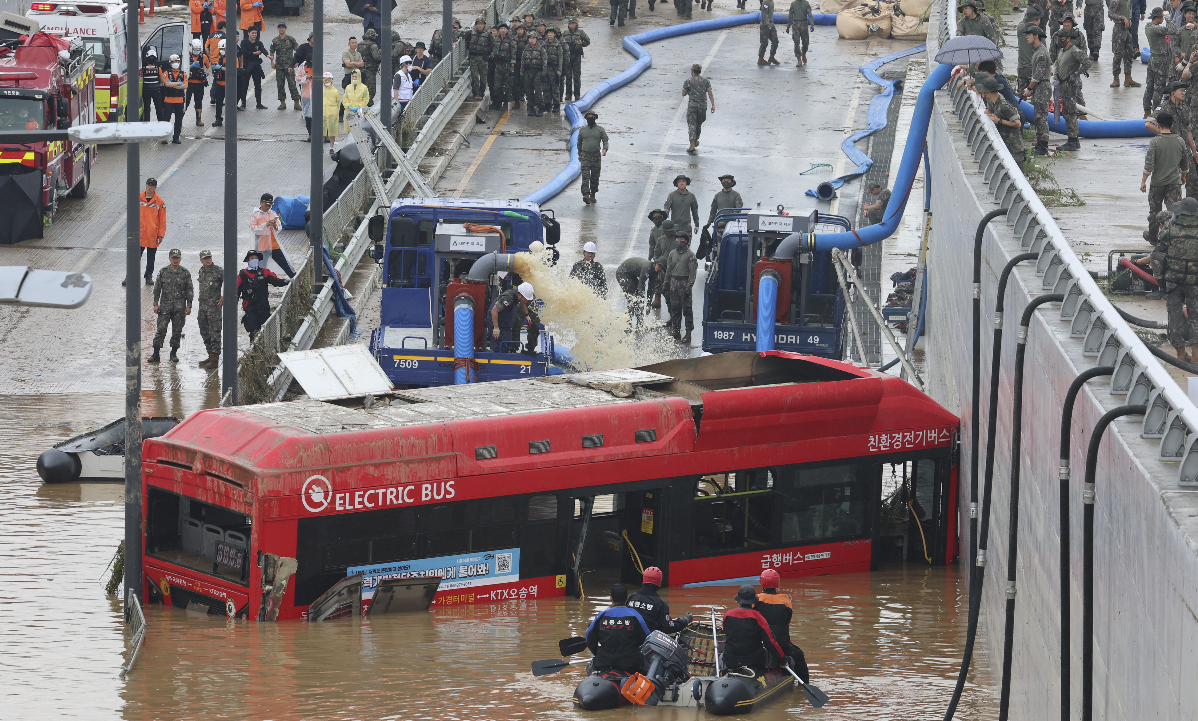 Rescuers search for survivors along a road submerged by floodwaters leading to an underground tunnel in Cheongju, South Korea, Sunday, July 16, 2023. Photo / AP