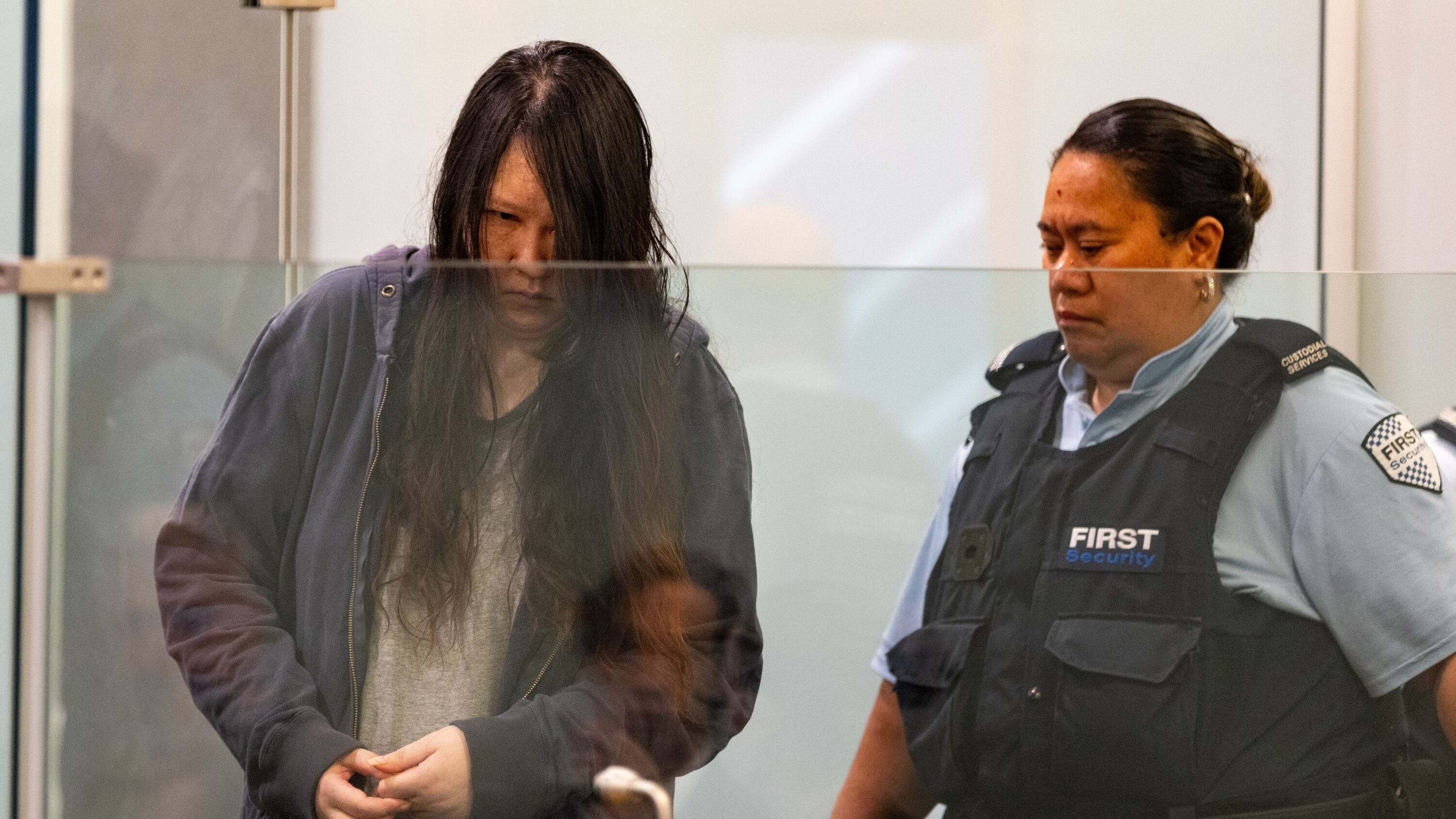 Hakyung "Jasmine" Lee appears in court for sentencing after having been found guilty of murdering her two young children. Photo / Michael Craig
