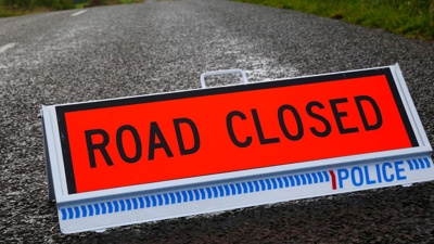 State Highway 25 closed after truck crash brings live powerlines down on the road