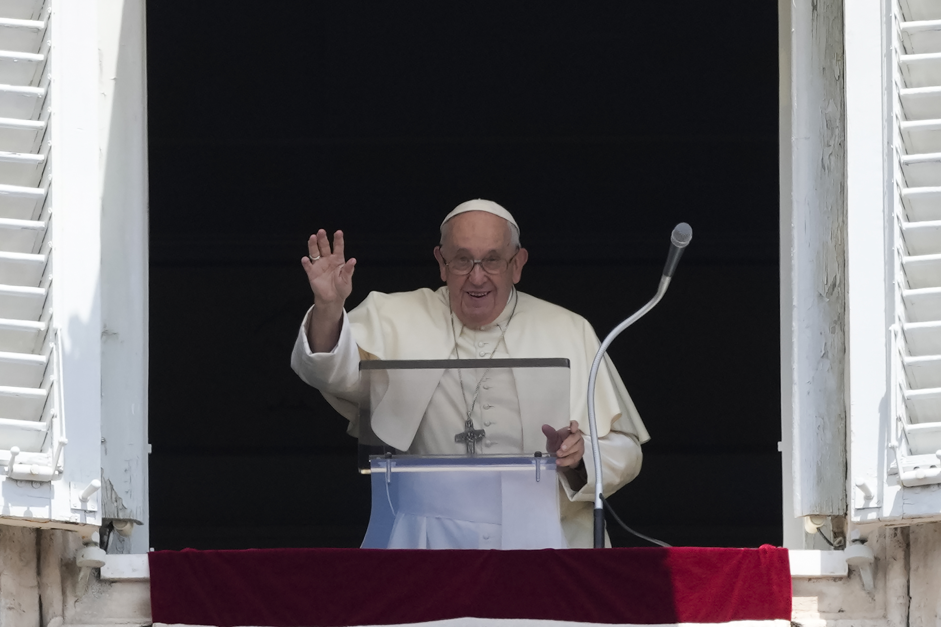 Pope Francis waves as he arrives for the Angelus noon prayer from the window of his studio overlooking St.Peter's Square, at the Vatican, Sunday, July 2, 2023. Photo / AP