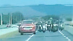 Witness footage has revealed Tribesmen gang members driving recklessly on the Waikato Expressway before a violent assault on a man. (Photo / Supplied)