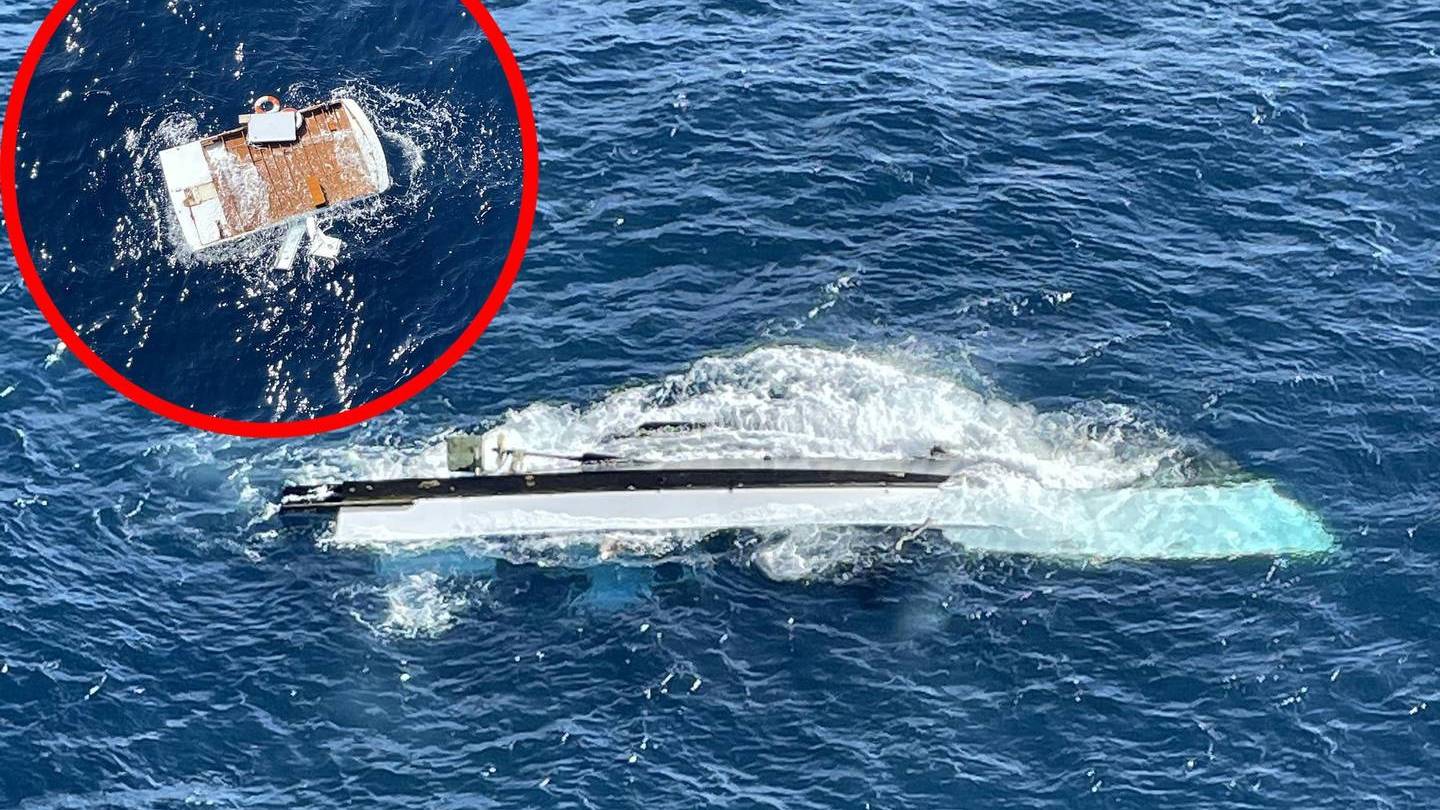 Wreckage (inset) and the capsized hull of the Enchanter, which sank off Murimotu on Sunday night with the loss of five lives. Photo / supplied